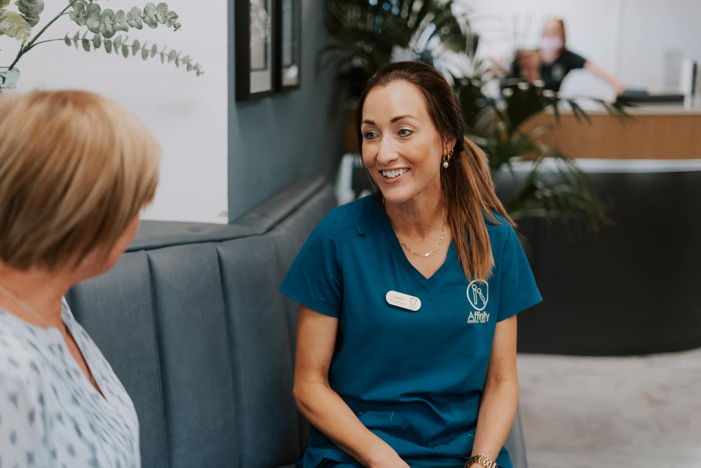 A patient chatting with her dentist